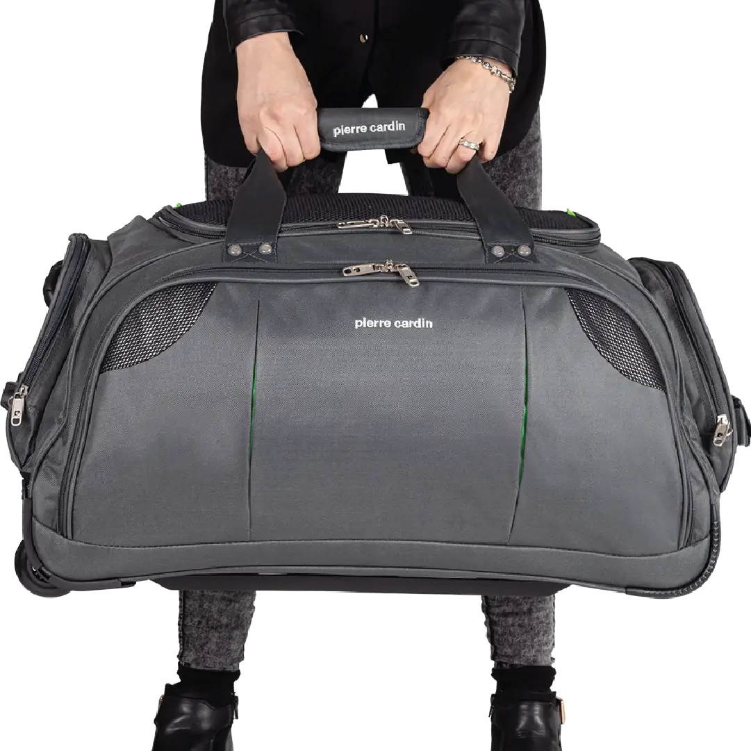 Person holding a gray duffel bag with 'Pierre Cardin' branding on a white background