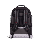 The back view of a black and gray backpack with mesh padding, padded shoulder straps, and a light gray bottom panel with small printed icons, shown on a plain white background.