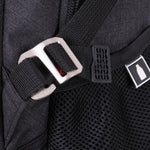 Close up of a strap on a grey backpack with a buckle fastening and a mesh pocket pictured.