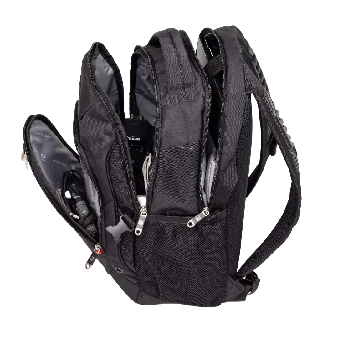 A black technical backpack shown open, revealing multiple compartments, padded shoulder straps, a mesh side pocket, and internal storage with electronic equipment inside, set against a plain white background.