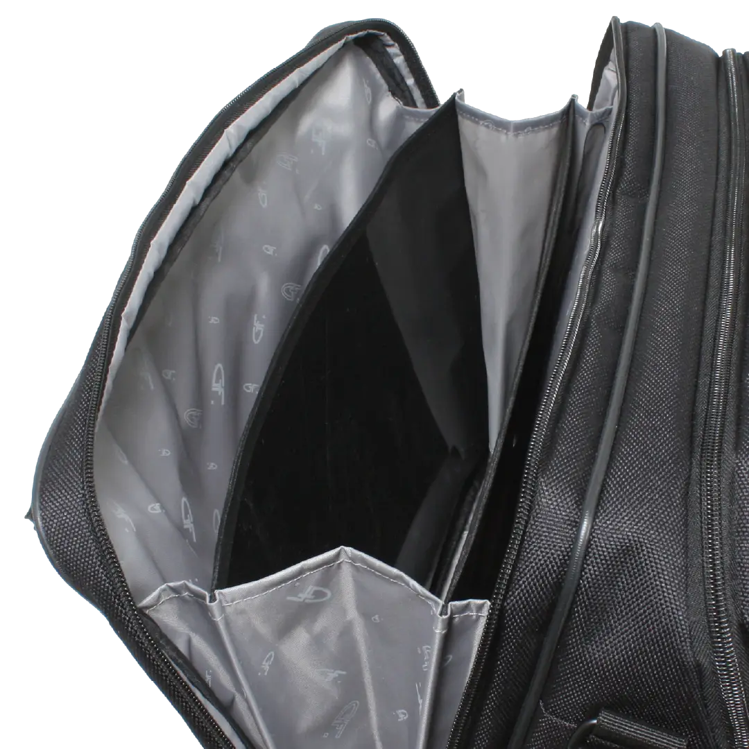 Close-up of the open interior of a black textured bag, showing a gray patterned inner lining and interior compartments against a white background.