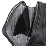 Close-up of the open interior of a black textured bag, showing a gray patterned inner lining and interior compartments against a white background.