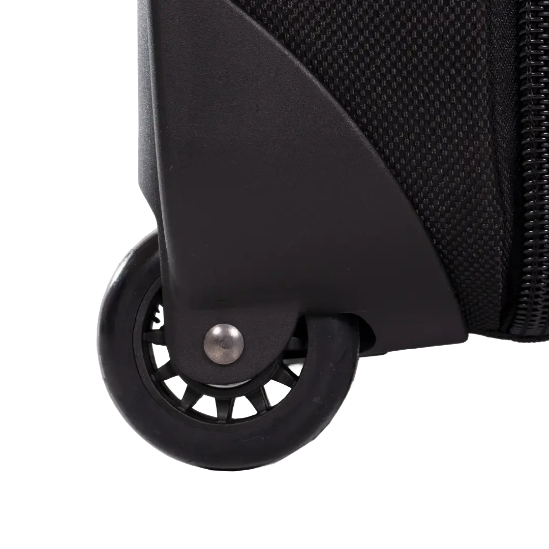 Close-up of a black rolling suitcase wheel and part of the suitcase body on a white background.