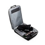 An open black and silver travel organizer bag with a telescoping handle, shown on a white background. Inside, a black glove and other travel accessories are neatly packed.