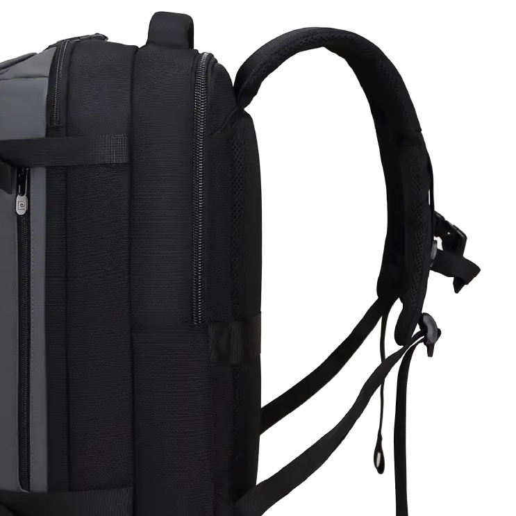 A black and dark gray backpack shown from the side profile on a solid white background.