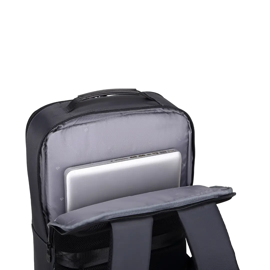 A black backpack shown open on a white background, with a silver laptop tucked into a padded gray compartment inside.