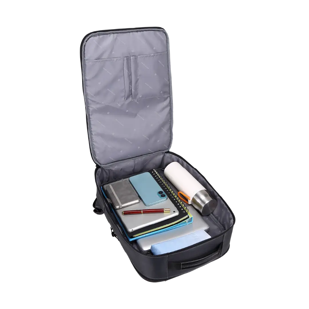 An open gray and black laptop backpack shown on a white background, filled with notebooks, a tablet, a phone, a pen, and a white bottle.
