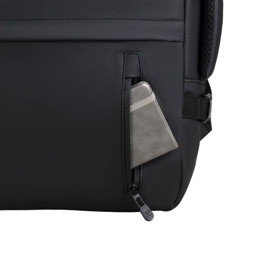 Close-up of a black backpack side pocket with a zipper, showing a gray cardholder or wallet inserted, on a white background.