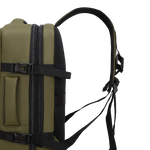 Side view of an olive green backpack with black straps, buckles, and mesh padding, shown on a plain white background.