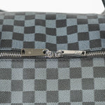 Close-up of a checkered pattern with a zipper on a gray background