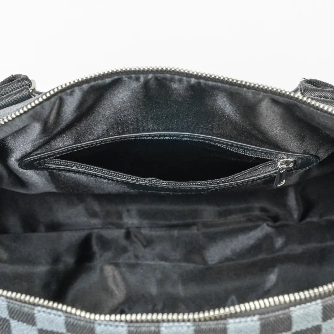 Black handbag with a visible brand logo on a white background