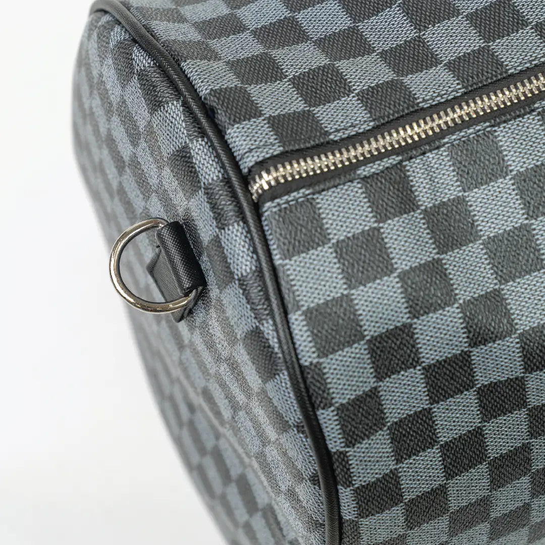 Checkered patterned bag with a zipper on a white background