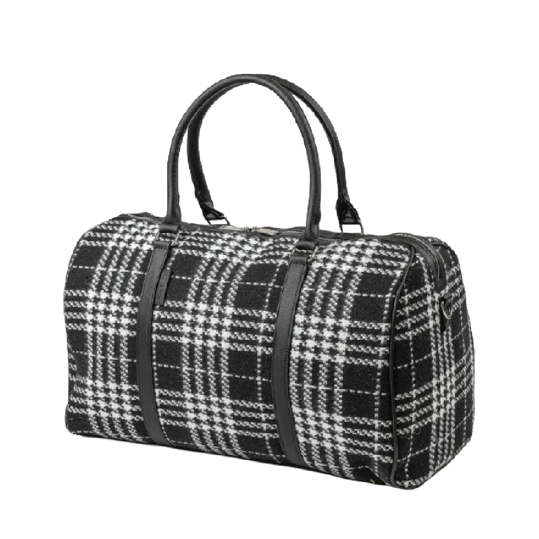 Black and white plaid duffel bag with black straps on a white background