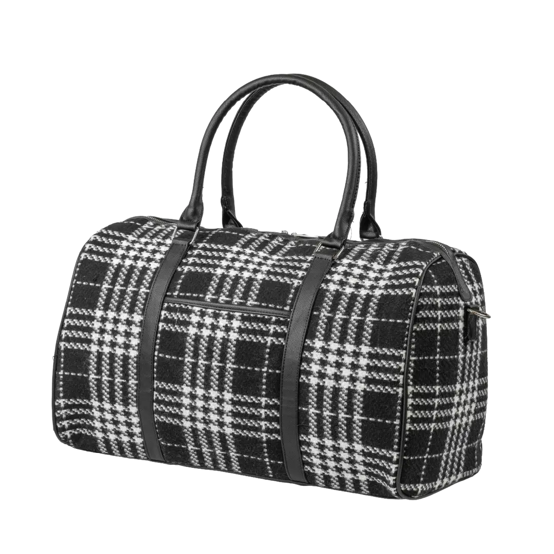 Black and white checkered duffel bag with black straps on a white background