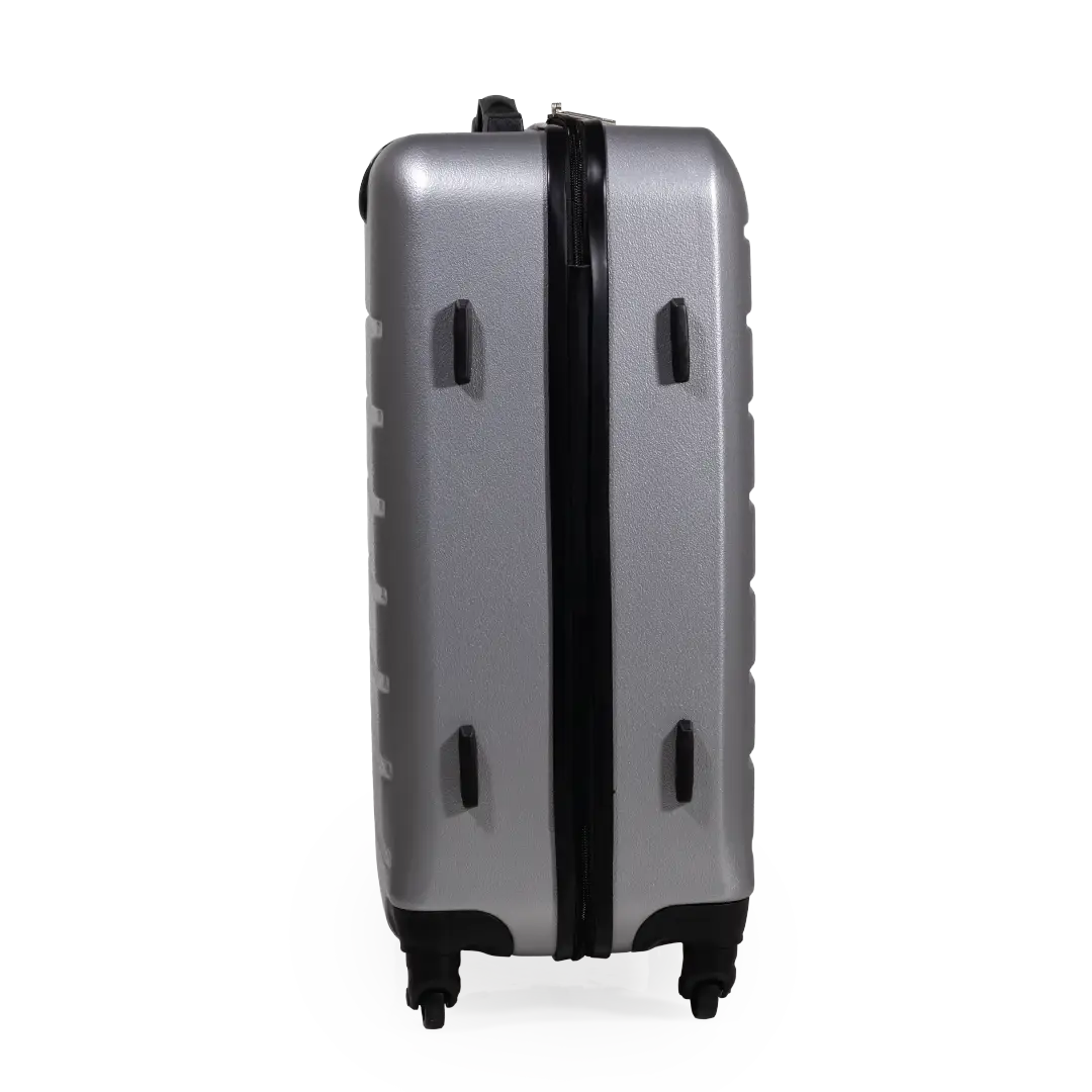 Silver suitcase with black handle and wheels on a white background