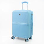 Light blue suitcase with a textured surface on a white background