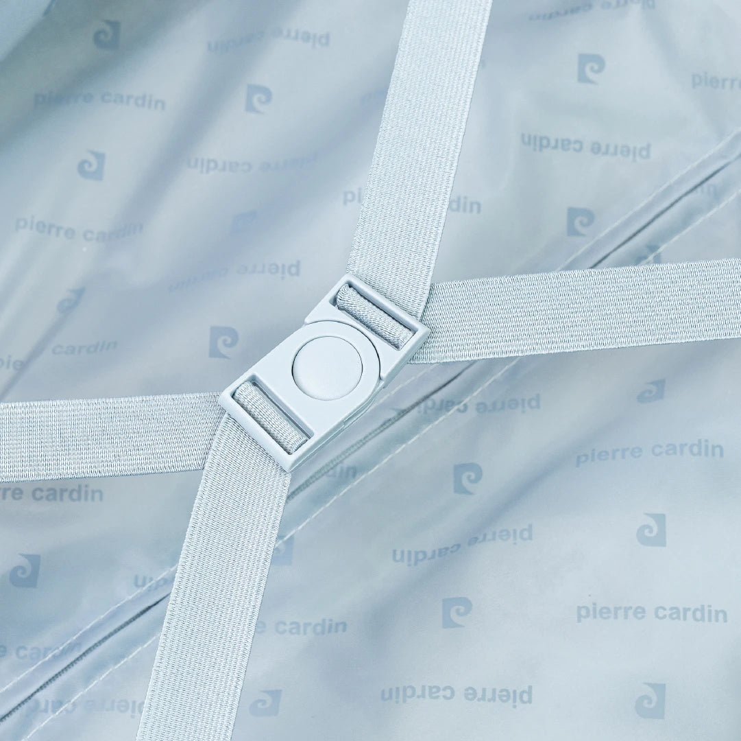 Suitcase interior with a strap and buckle, featuring the brand 'Pierre Cardin'.
