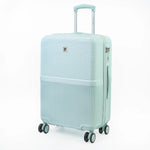 Light green suitcase with a visible brand logo on a white background