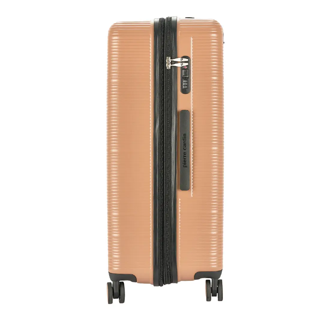 Tan suitcase with black zipper and wheels on a white background