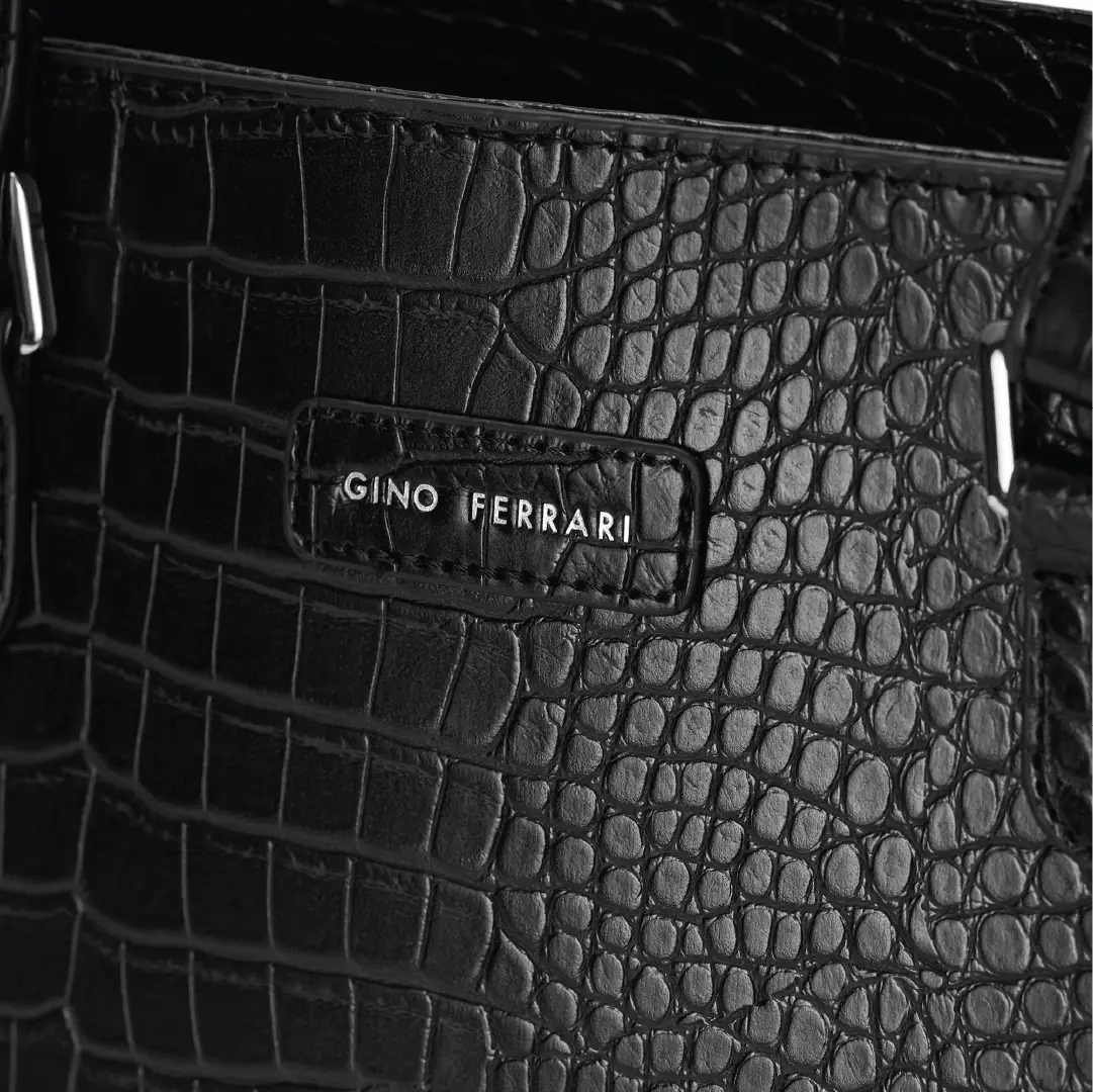 Black textured handbag with 'Gino Ferrari' logo