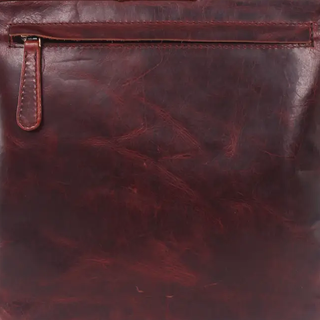 A dark reddish-brown leather crossbody bag with a front zippered pocket and a top flap, shown against a plain white background.