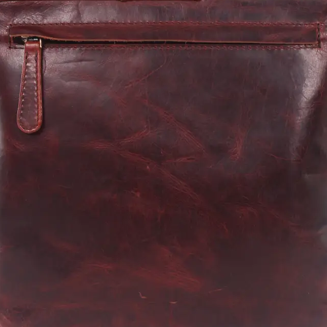 A dark reddish-brown leather crossbody bag with a front zippered pocket and a top flap, shown against a plain white background.