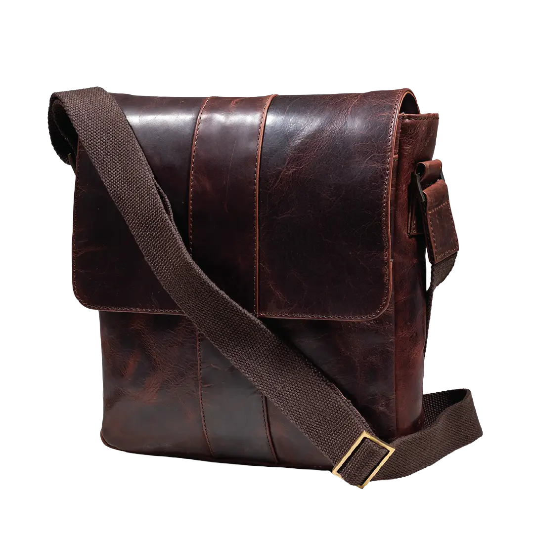 A dark brown distressed leather messenger bag with a wide adjustable canvas shoulder strap, shown on a solid white background.