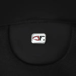 A close-up of a black textured fabric accessory featuring a central silver badge with a red and black stylized 'GF' logo.