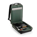 An open dark green laptop interior backpack is shown on a white background, containing a silver laptop, notebook, and other accessories.