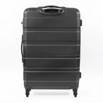 Black suitcase with a textured surface on a white background