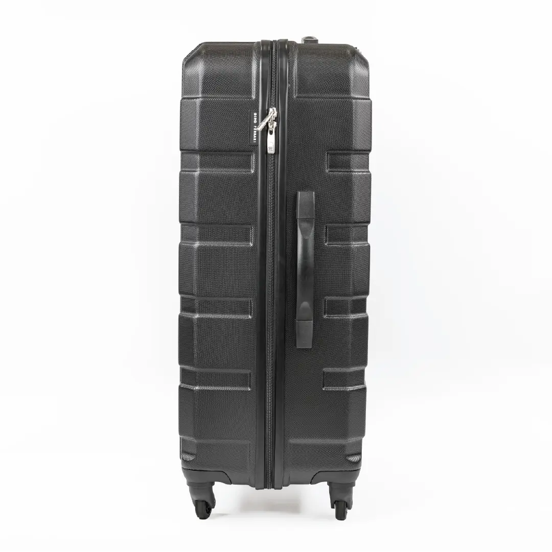 Black suitcase with a textured surface on a white background
