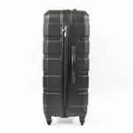 Black suitcase with a textured surface on a white background