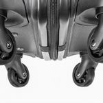 Close-up of a gray suitcase with wheels on a white background