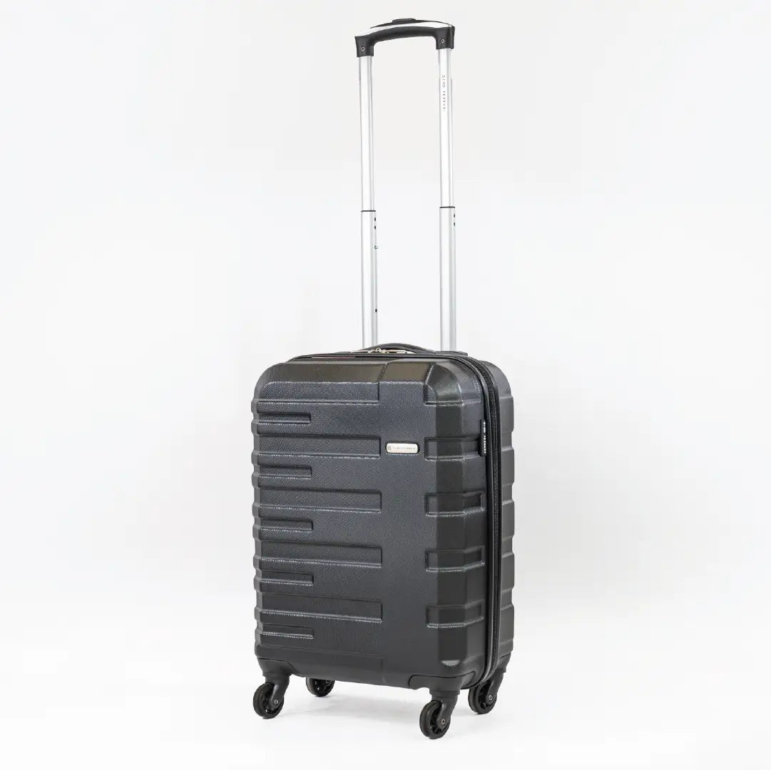 A black cabin-sized suitcase with the handle pulled up.