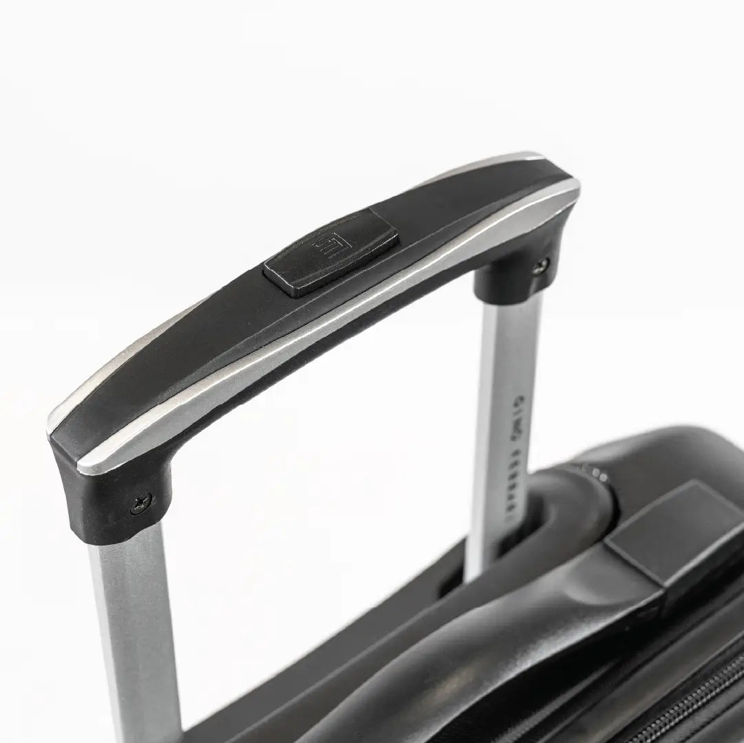 A handle of a black suitcase.