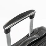 A handle of a black suitcase.