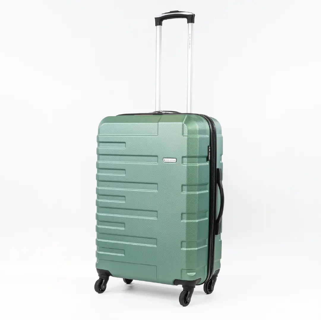 Green suitcase with a textured surface on a white background