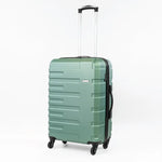 Green suitcase with a textured surface on a white background