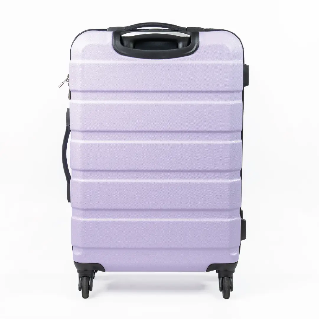 Lavender suitcase with black handle and wheels on a white background