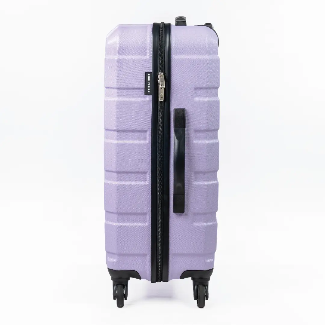 Purple suitcase with black handle and wheels on a white background
