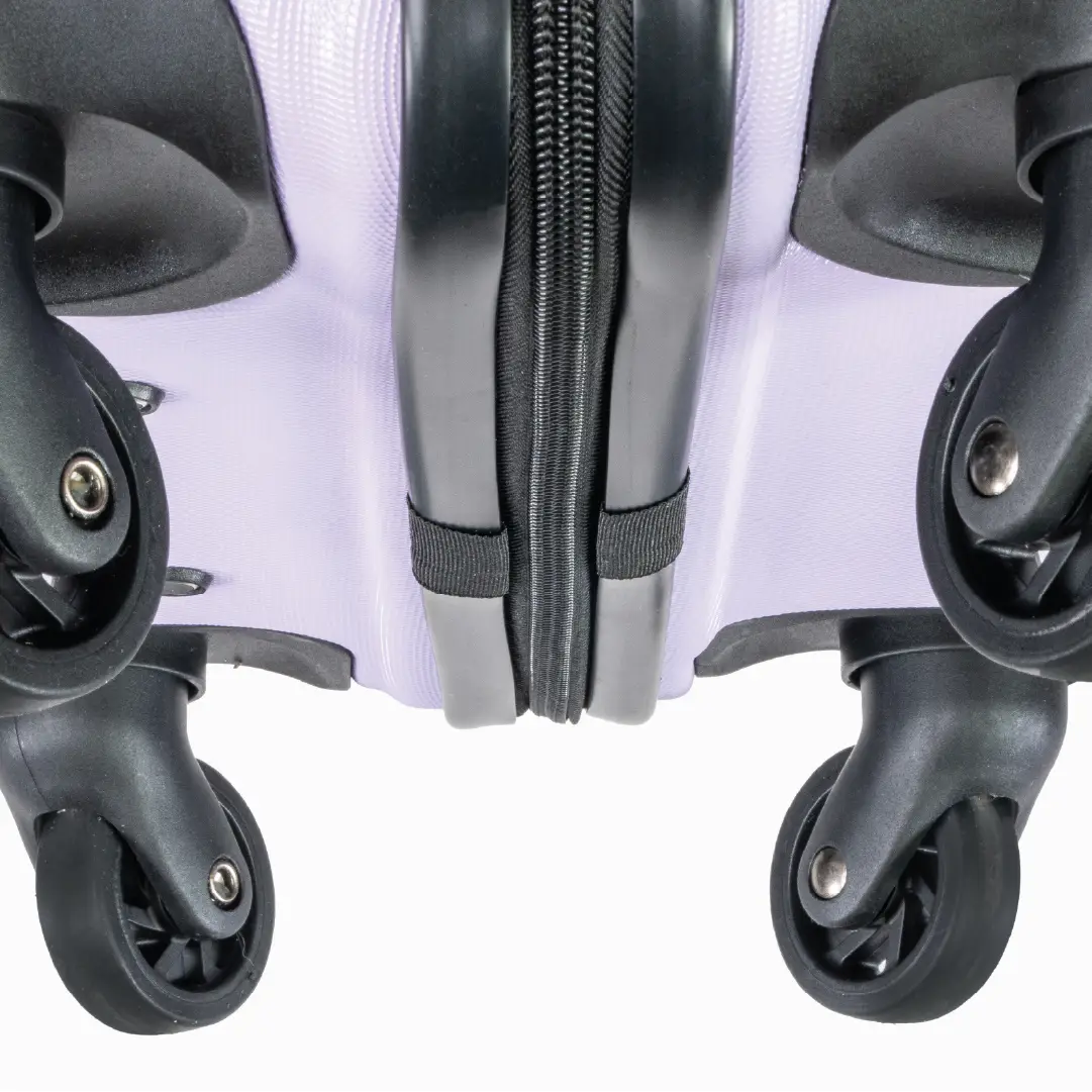 Close-up of a hard shell suitcase with wheels and zippers on a white background