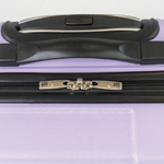Close-up of a purple suitcase with a black handle on a white background 