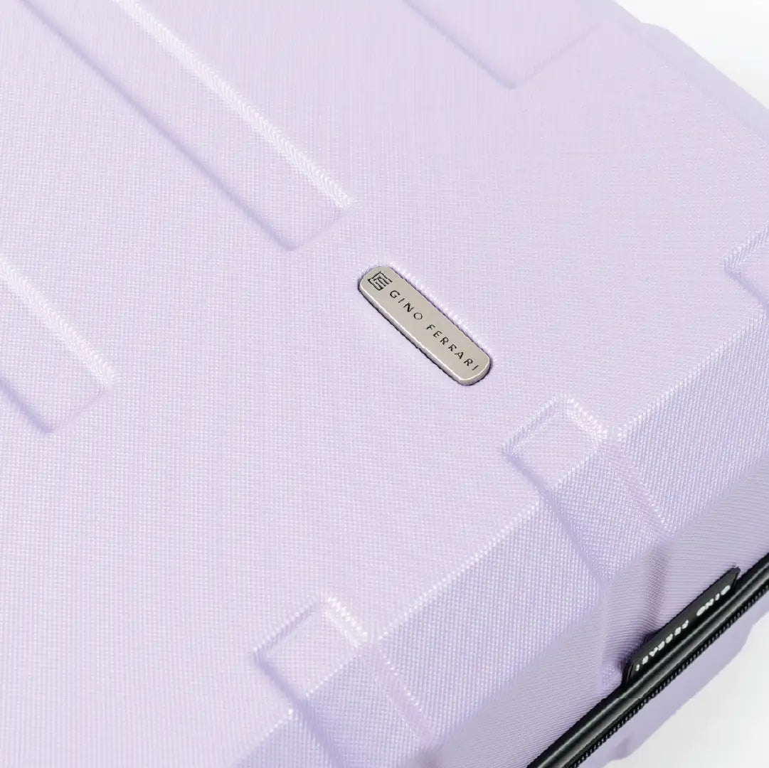 Lilac purple Gino Ferari suitcase close up.