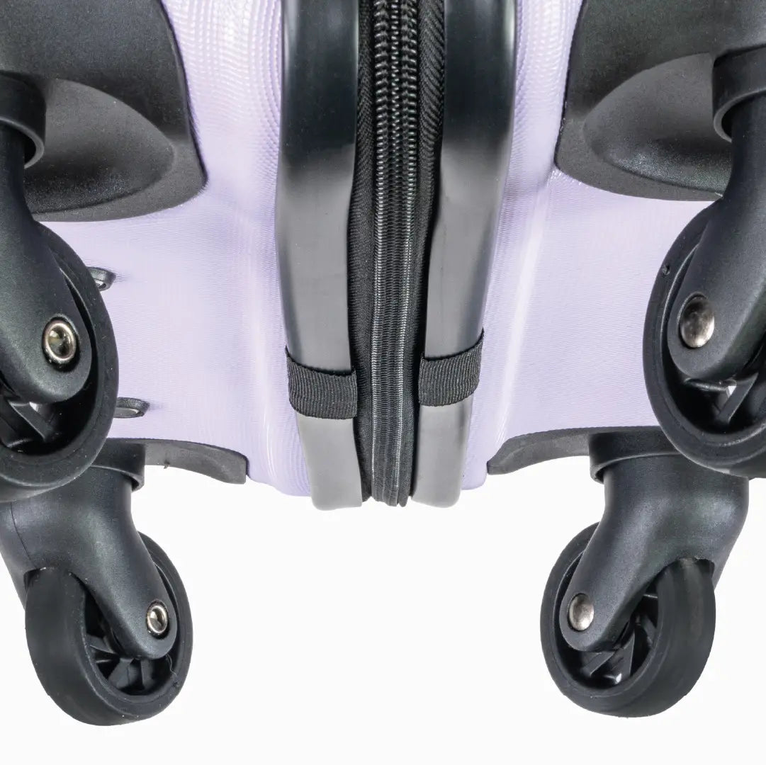 Close-up of the bottom of a suitcase showing the wheels and zipper.