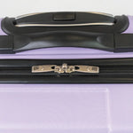 Close-up of a purple suitcase handle and zipper