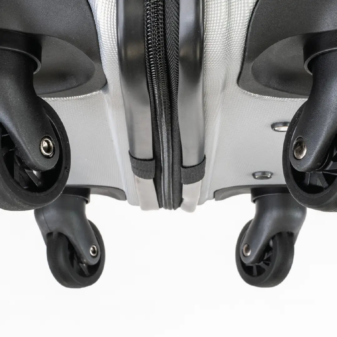 Close-up of a suitcase with wheels on a white background