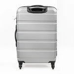 Silver suitcase with black handle and wheels on a white background