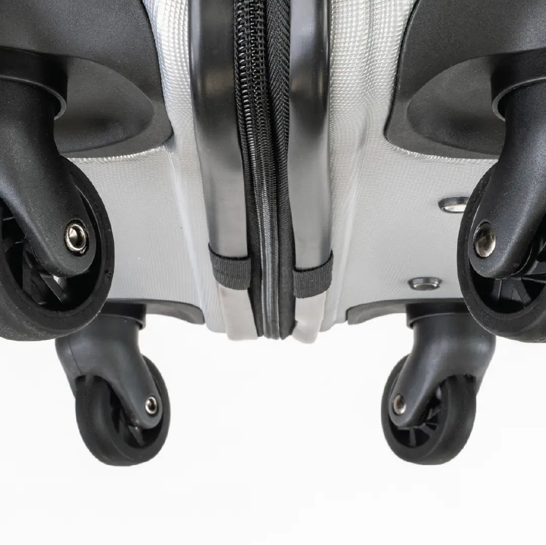 Close-up of a suitcase with wheels on a white background