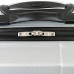 Close-up of a silver suitcase with a black handle and zipper.