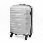 Silver cabin-sized suitcase with black wheels.